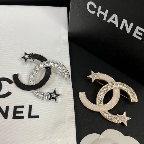 Chanel CC Brooch Silver and Black with Two Small Stars