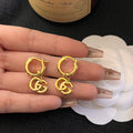 Gucci GG Running Drop Earrings in Gold