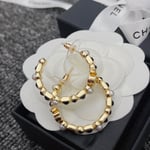 Chanel Gold & Black Metal Hoop Earrings