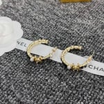 Chanel Gold & Black Metal Hoop Earrings