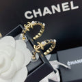 Chanel Gold & Black Metal Hoop Earrings